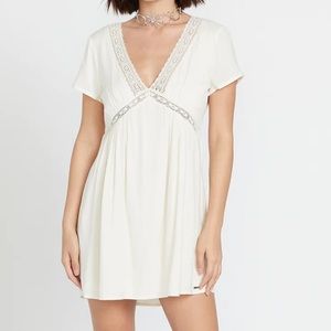 Volcom cream dress size medium. BNWT. Lace details. Tie back